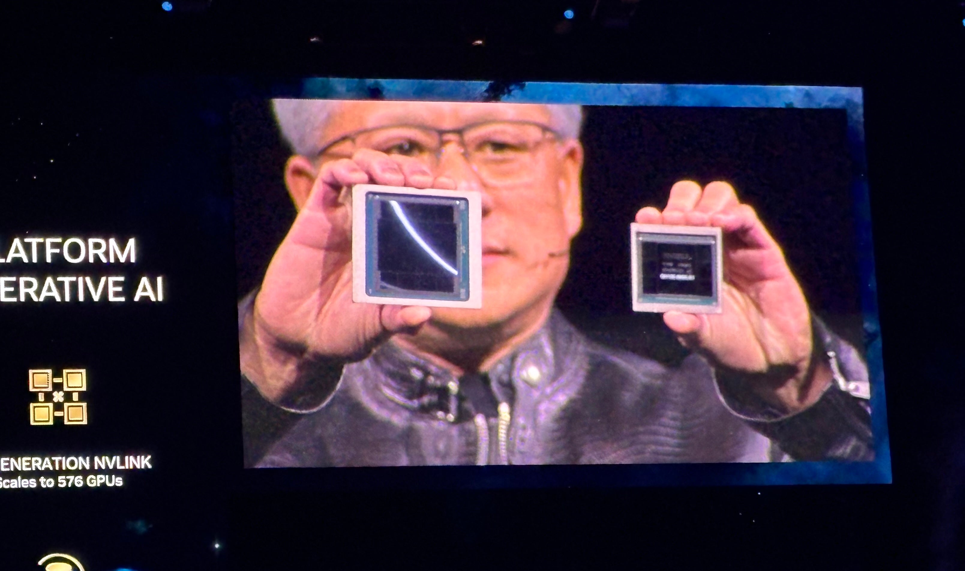 NVIDIA CEO Jensen Huang shows the Blackwell (left) and Hopper (right) GPUs at NVIDIA GTC 2024 in San Jose, California on March 18.